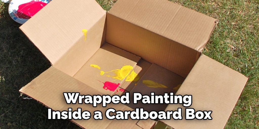 Wrapped Painting Inside a Cardboard Box