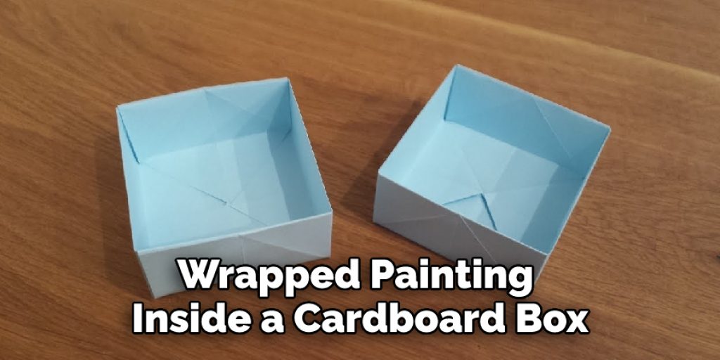 Wrapped Painting Inside a Cardboard Box