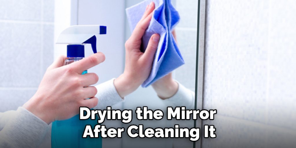 Drying the Mirror After Cleaning It