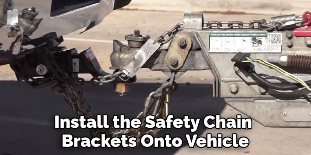 Install the Safety Chain 
Brackets Onto Vehicle