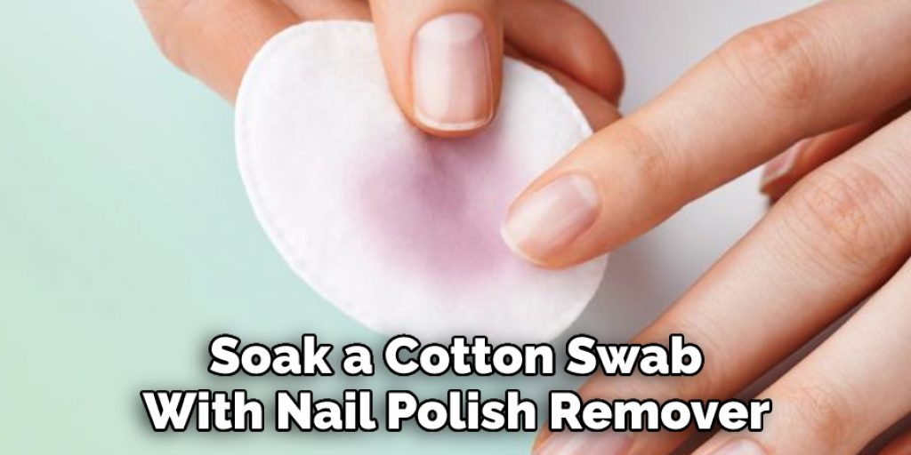 Soak a Cotton Swab With Nail Polish Remover 