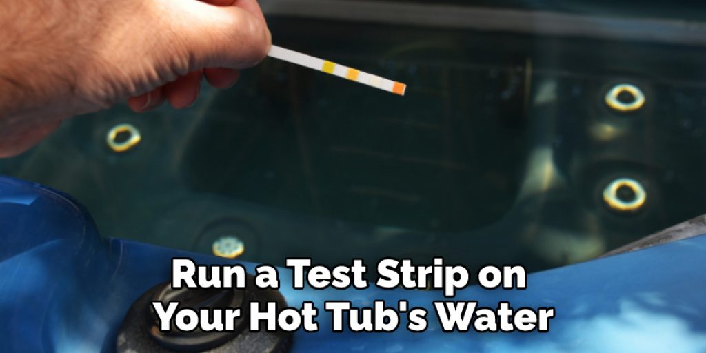 Run a Test Strip on Your Hot Tub's Water