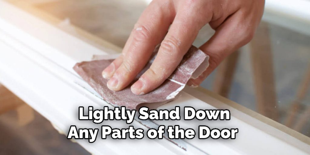 Lightly Sand Down Any Parts of the Door 