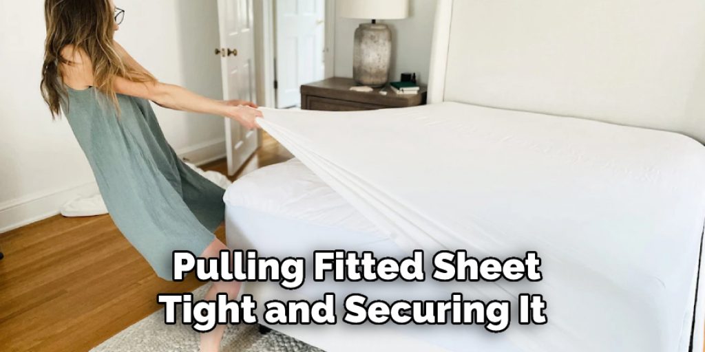 Pulling Fitted Sheet Tight and Securing It 