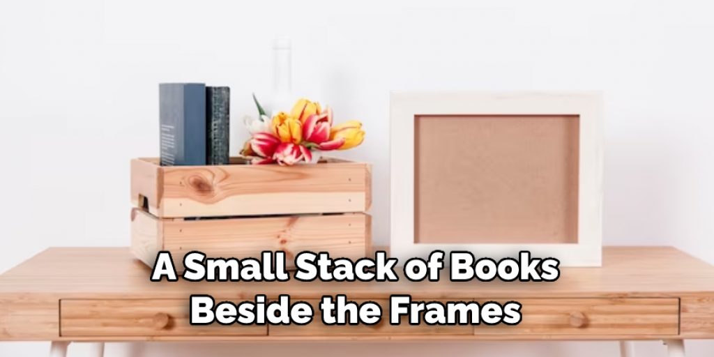 A Small Stack of Books Beside the Frames