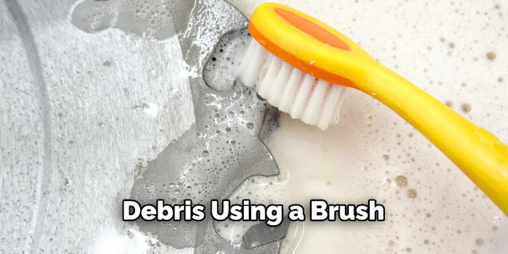 Debris Using a Brush