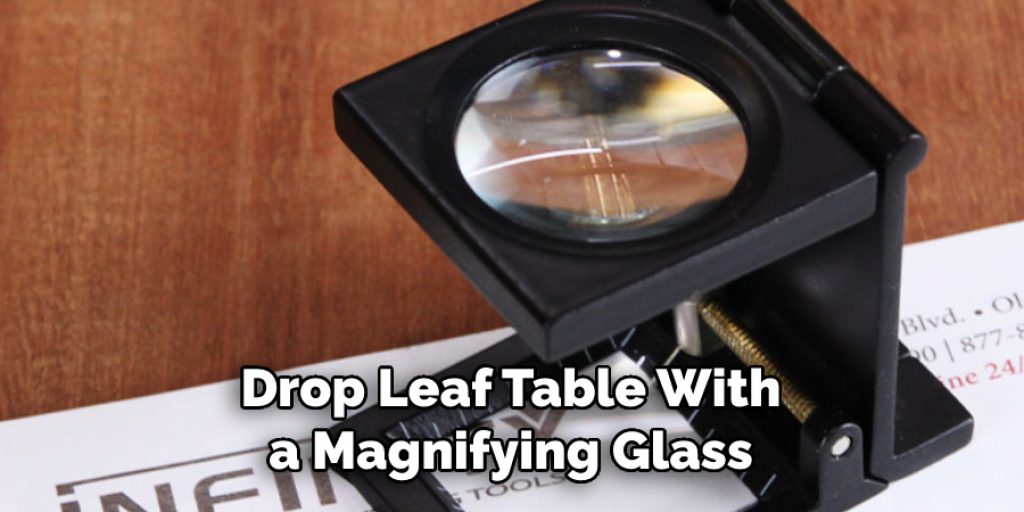 Drop Leaf Table With
a Magnifying Glass