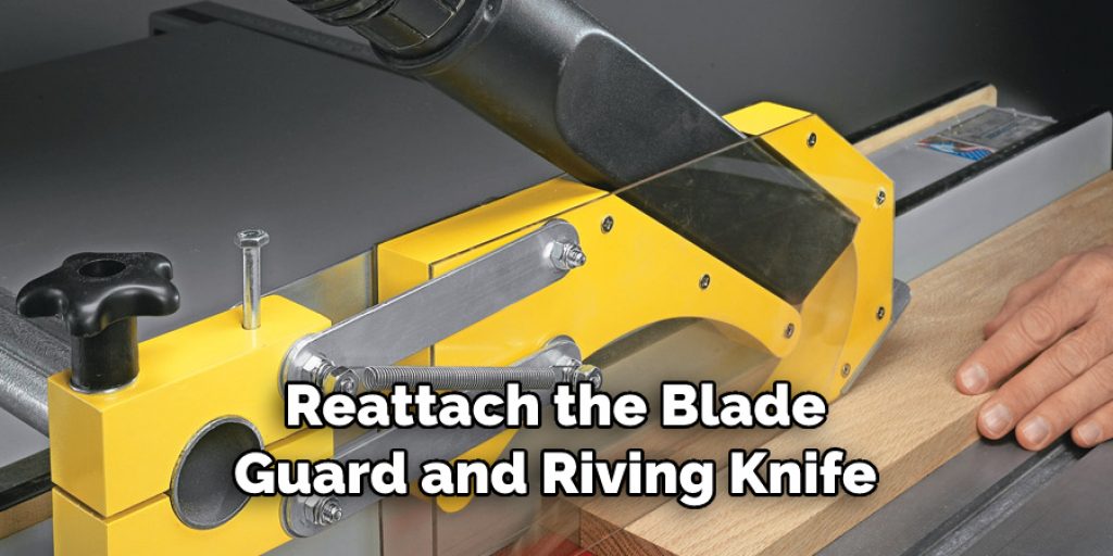 Reattach the Blade Guard and Riving Knife