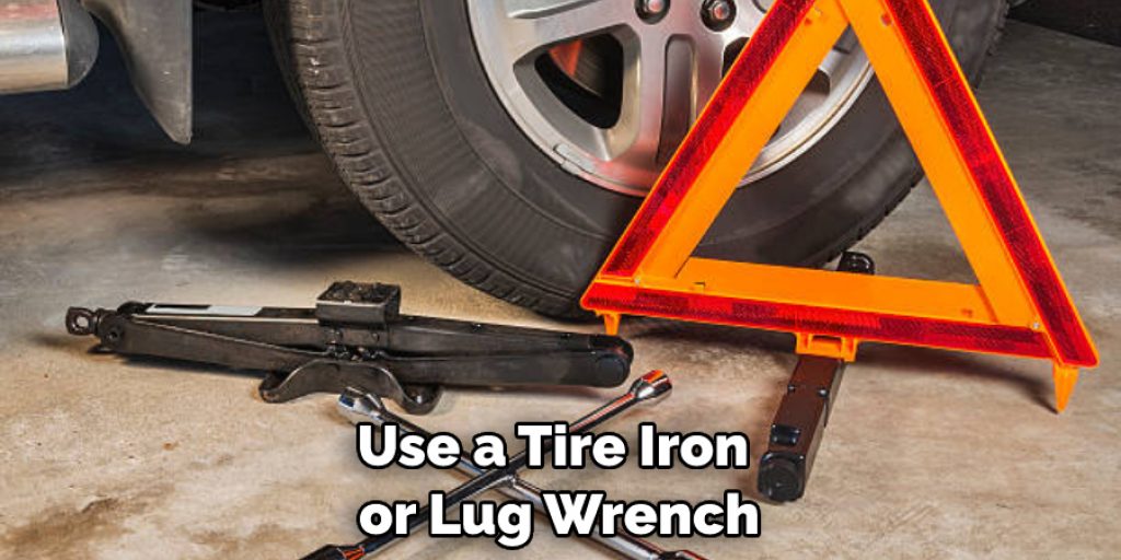 Use a Tire Iron or Lug Wrench