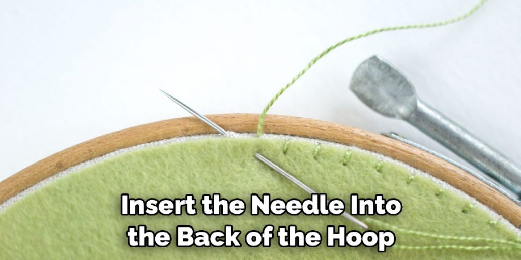 Insert the Needle Into the Back of the Hoop