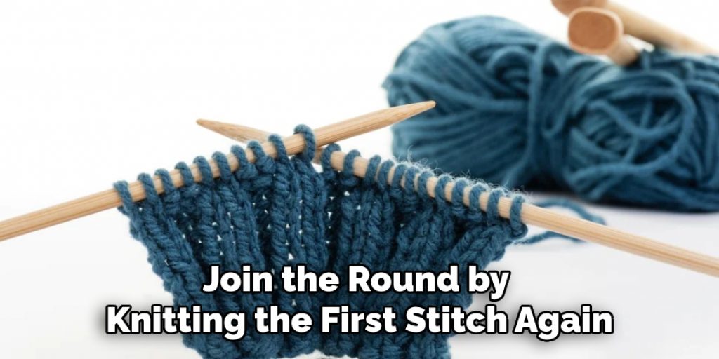 Join the Round by 
Knitting the First Stitch Again