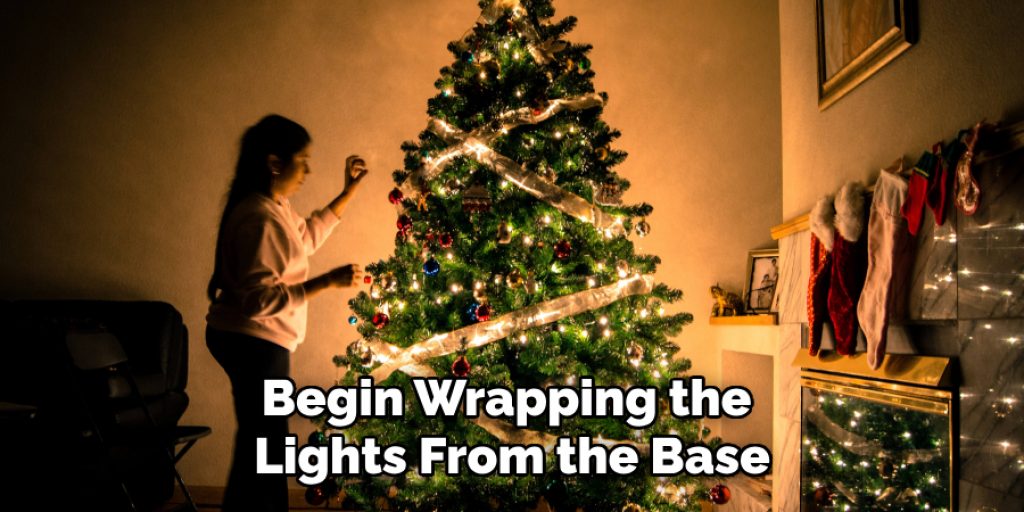 Begin Wrapping the Lights From the Base
