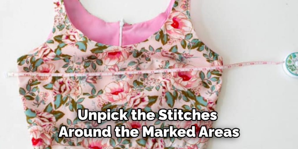 Unpick the Stitches 
Around the Marked Areas