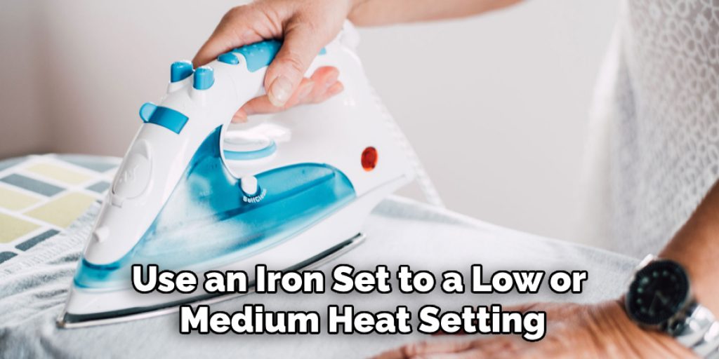 Use an Iron Set to a Low or Medium Heat Setting
