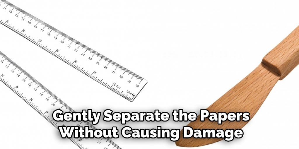 Gently Separate the Papers Without Causing Damage