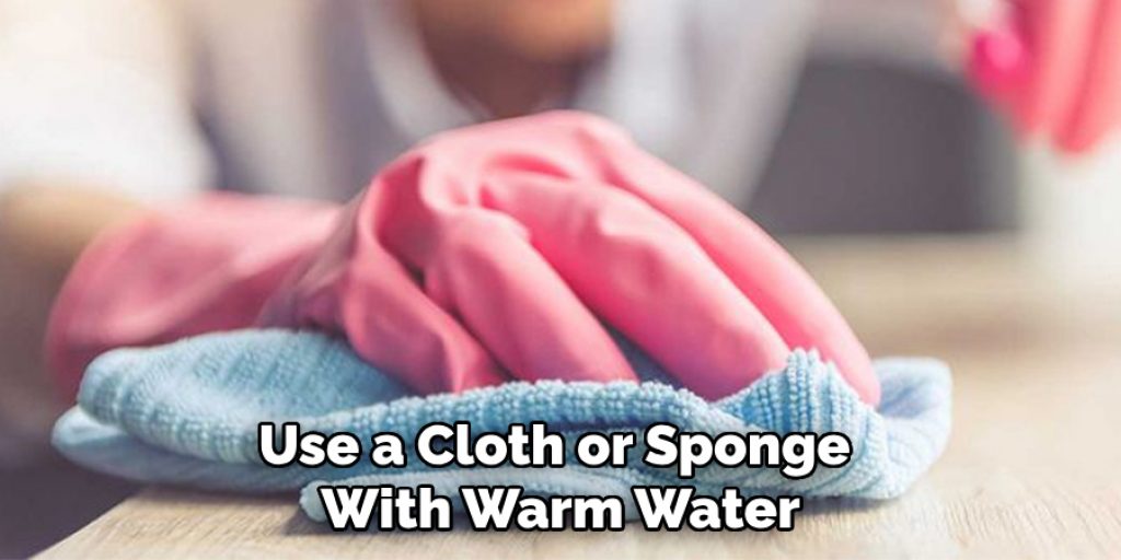 Use a Cloth or Sponge With Warm Water