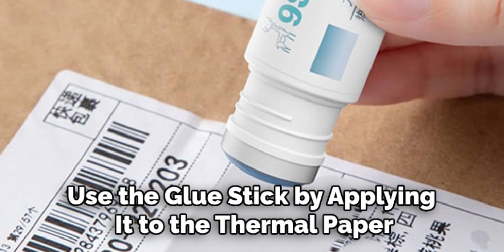 Use the Glue Stick by Applying It to the Thermal Paper