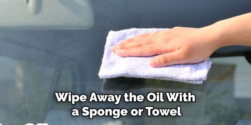 Wipe Away the Oil With a Sponge or Towel